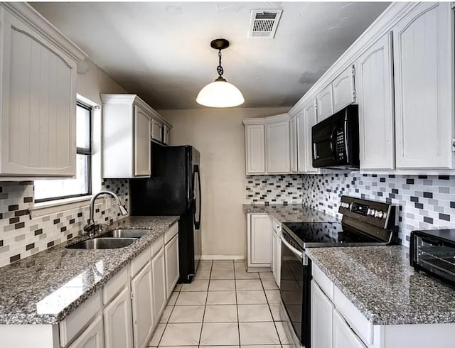 1213 Dennis Dr, Saginaw, TX 76179 - kitchen featuring a sink, decorative backsplash, light tile patterned floors, visible vents, and black appliances