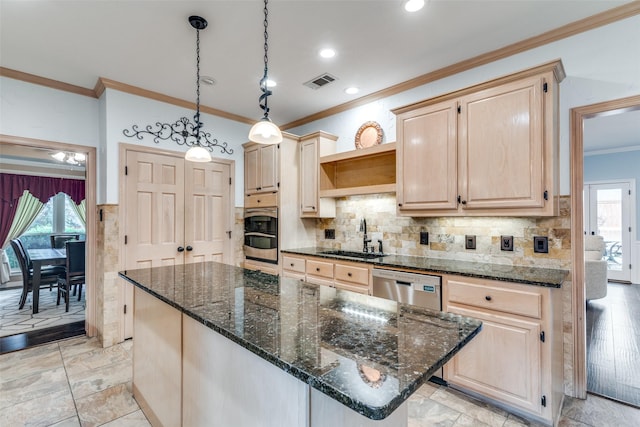 2516 Nighthawk Dr, Plano, TX 75025 - kitchen with light brown cabinetry, visible vents, a sink, crown molding, and appliances with stainless steel finishes