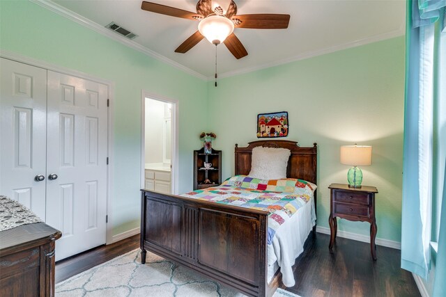 2516 Nighthawk Dr, Plano, TX 75025 - bedroom featuring a closet, crown molding, dark wood finished floors, visible vents, and baseboards
