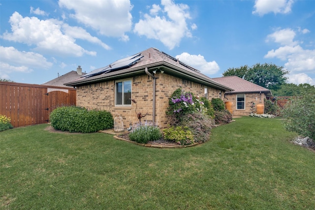 2516 Nighthawk Dr, Plano, TX 75025 - back of property featuring a yard, a ceiling fan, a patio area, roof with shingles, and a fenced backyard
