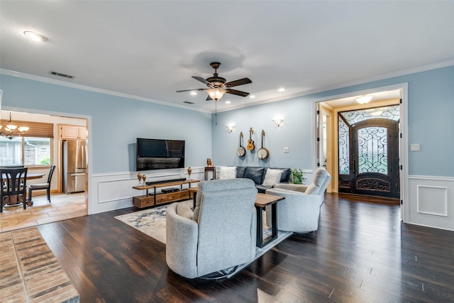 2516 Nighthawk Dr, Plano, TX 75025 - living area featuring crown molding, visible vents, wood finished floors, and a wainscoted wall