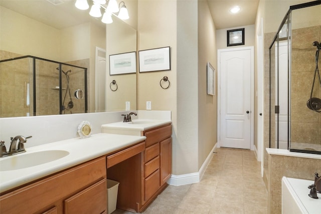 bathroom featuring a stall shower, tile patterned flooring, double vanity, baseboards, and a chandelier