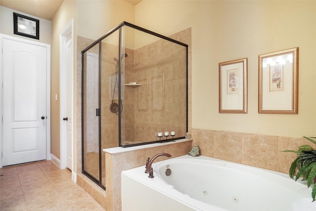 bathroom with a shower stall, a tub with jets, and tile patterned floors