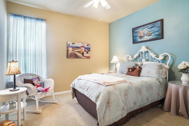 bedroom with multiple windows, carpet floors, baseboards, and ceiling fan