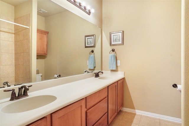 full bathroom with tile patterned flooring, toilet, baseboards, double vanity, and a shower