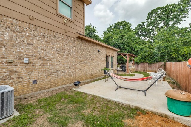 2868 Pacifico Way, Fort Worth, TX 76111 - fenced backyard featuring central AC unit and a patio