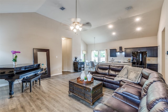 2868 Pacifico Way, Fort Worth, TX 76111 - living room featuring ceiling fan, light wood-type flooring, high vaulted ceiling, baseboards, and recessed lighting