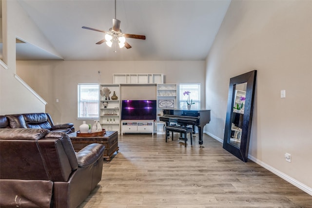2868 Pacifico Way, Fort Worth, TX 76111 - living area with lofted ceiling, a ceiling fan, light wood-style floors, and baseboards
