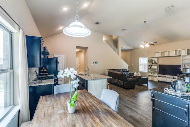 2868 Pacifico Way, Fort Worth, TX 76111 - dining space with lofted ceiling, ceiling fan, and dark wood-type flooring