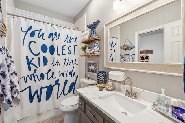 bathroom featuring vanity, shower / bath combo with shower curtain, and toilet