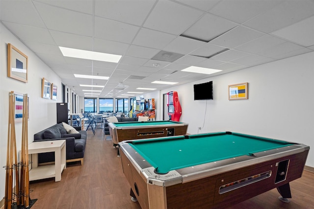 rec room with a paneled ceiling, wood finished floors, and pool table