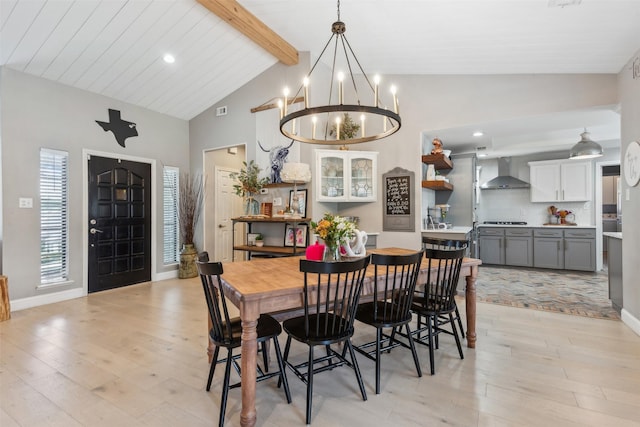 dining room with baseboards, a chandelier, light wood-style floors, vaulted ceiling with beams, and recessed lighting