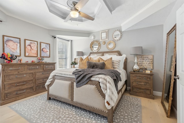 bedroom featuring crown molding, baseboards, ceiling fan, and light wood-style flooring