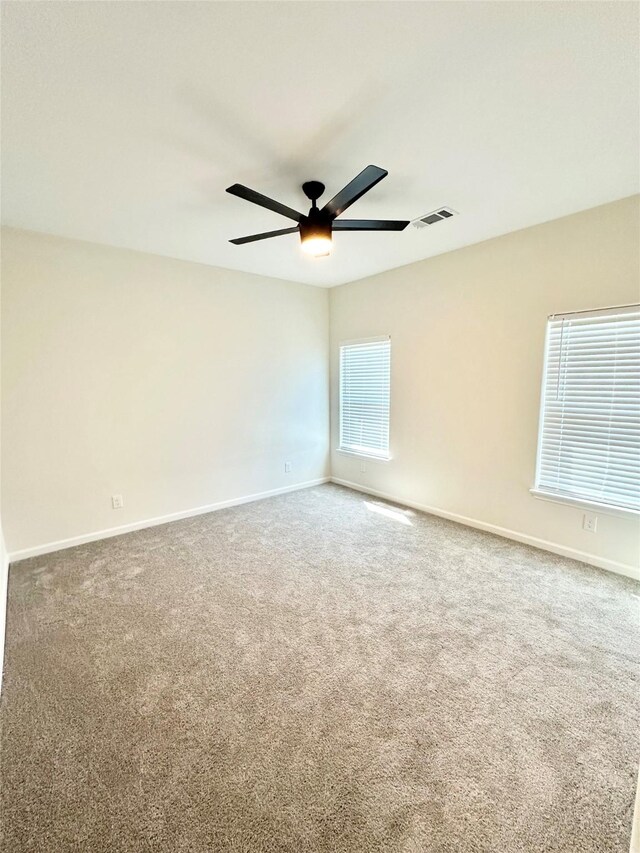 303 Third, Lindsay, TX 76250 - carpeted spare room featuring visible vents, baseboards, and ceiling fan