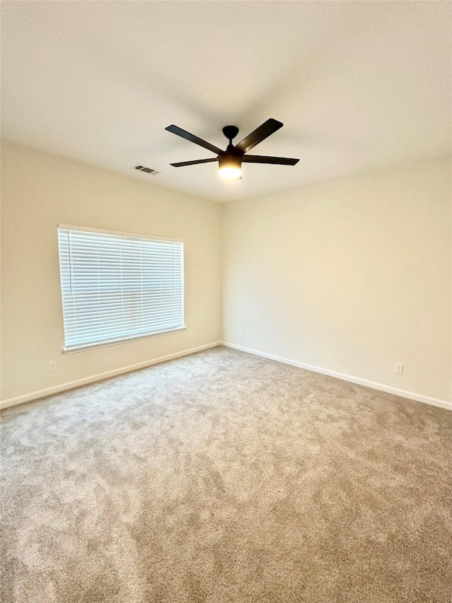 303 Third, Lindsay, TX 76250 - carpeted spare room featuring a ceiling fan, baseboards, and visible vents