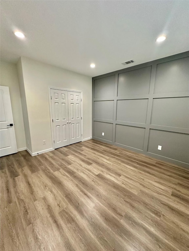 303 Third, Lindsay, TX 76250 - unfurnished bedroom featuring recessed lighting, baseboards, visible vents, and wood finished floors