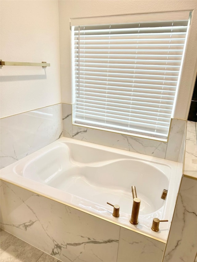 303 Third, Lindsay, TX 76250 - bathroom with marble finish floor and a garden tub