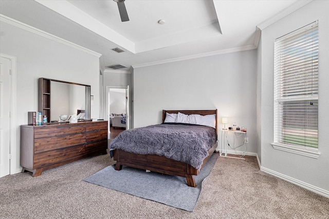 carpeted bedroom featuring crown molding, ceiling fan, visible vents, and a raised ceiling