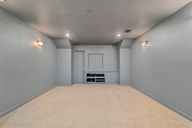 unfurnished room with visible vents, recessed lighting, baseboards, and light carpet