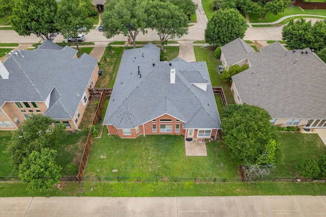 birds eye view of property with a residential view