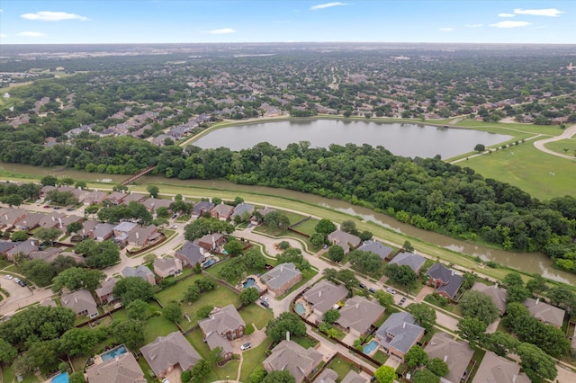 bird's eye view featuring a water view and a residential view
