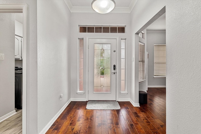 entrance foyer with crown molding, baseboards, and hardwood / wood-style floors