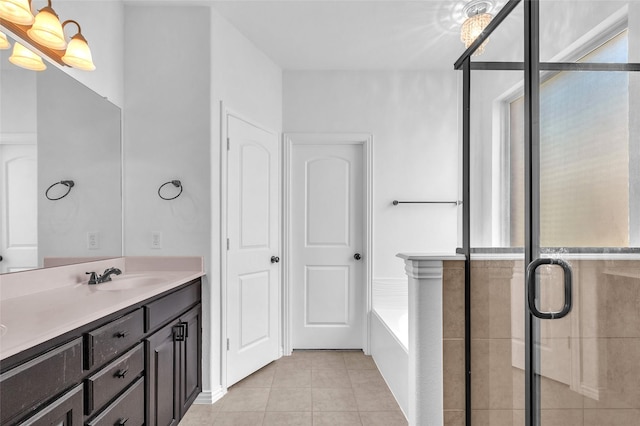 2317 Willard Dr, Mckinney, TX 75072 - full bathroom featuring tile patterned floors, a garden tub, double vanity, and a stall shower