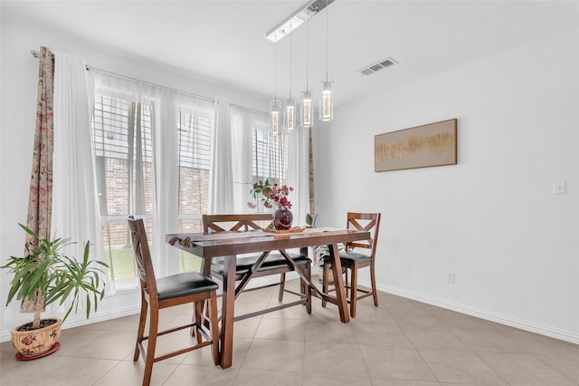 2317 Willard Dr, Mckinney, TX 75072 - dining area with baseboards and light tile patterned flooring