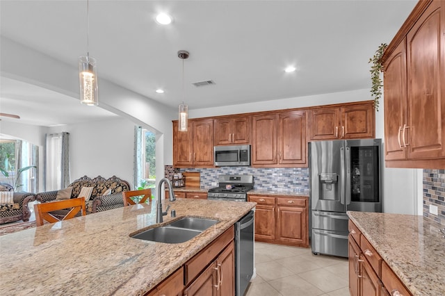 2317 Willard Dr, Mckinney, TX 75072 - kitchen featuring appliances with stainless steel finishes, a sink, light stone counters, backsplash, and recessed lighting