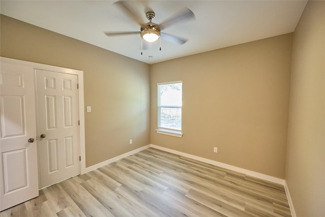 1224 W Bewick St, Fort Worth, TX 76110 - empty room with light wood-style flooring, ceiling fan, and baseboards