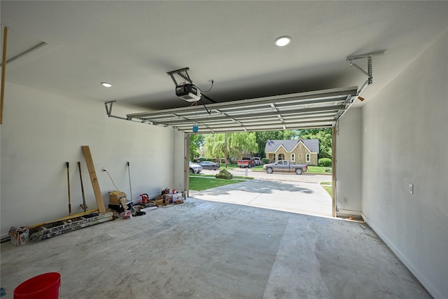 1224 W Bewick St, Fort Worth, TX 76110 - garage featuring a garage door opener and recessed lighting