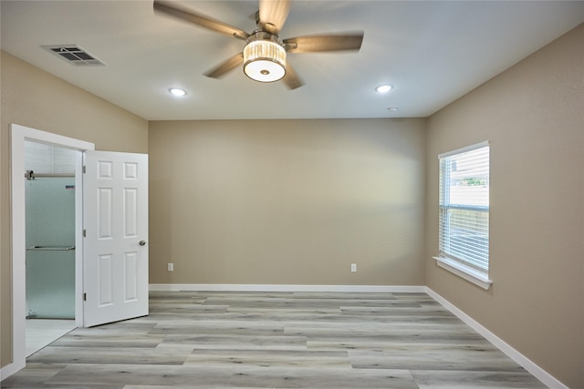 spare room with light wood-style floors, a ceiling fan, baseboards, and recessed lighting