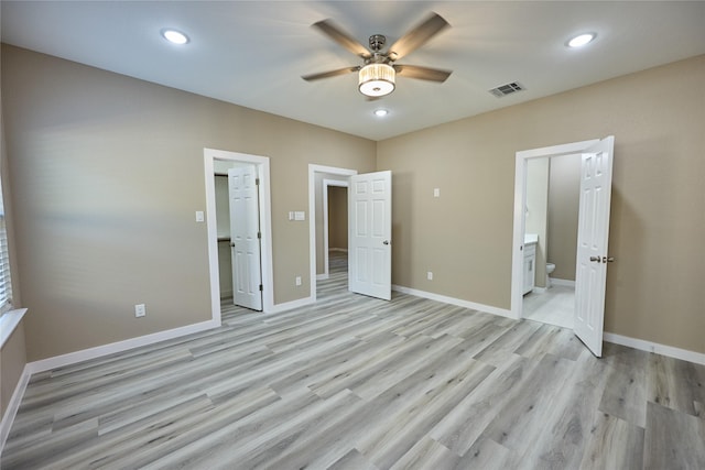 unfurnished bedroom with light wood-style floors, baseboards, ensuite bath, recessed lighting, and ceiling fan