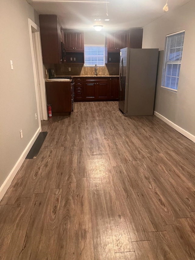 2345 Laughlin Dr, Dallas, TX 75228 - kitchen featuring freestanding refrigerator, dark wood-style flooring, and a sink