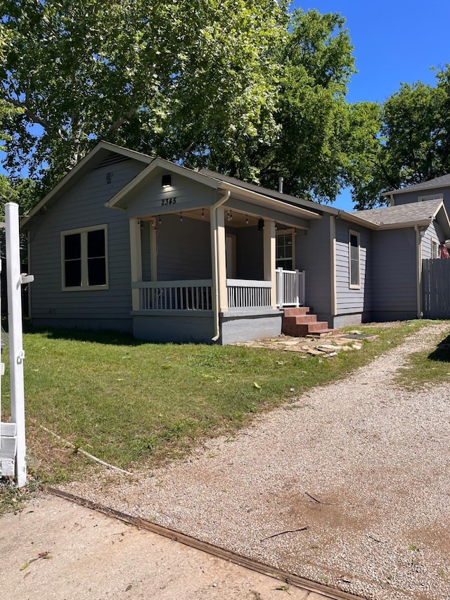 2345 Laughlin Dr, Dallas, TX 75228 - view of front of home featuring covered porch, a front lawn, and driveway