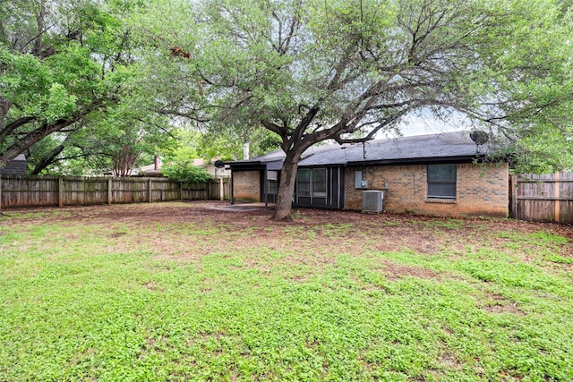 628 Evelyn Ln, Burleson, TX 76028 - view of yard featuring a fenced backyard and central AC