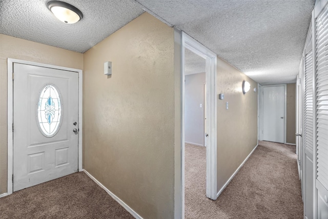 628 Evelyn Ln, Burleson, TX 76028 - carpeted foyer entrance with baseboards, a textured ceiling, and a textured wall