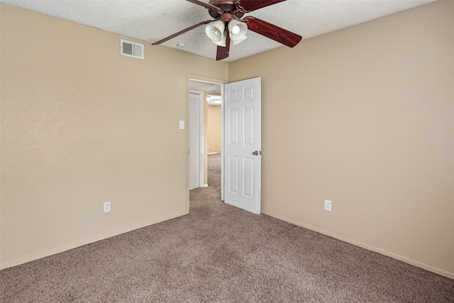 628 Evelyn Ln, Burleson, TX 76028 - spare room featuring ceiling fan, a textured ceiling, visible vents, baseboards, and carpet