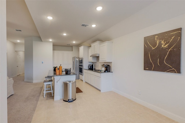 537 Val Verde St, Aubrey, TX 76227 - kitchen with recessed lighting, a kitchen bar, white cabinetry, and visible vents