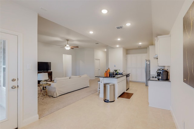 537 Val Verde St, Aubrey, TX 76227 - kitchen featuring a kitchen breakfast bar, a center island, recessed lighting, white cabinets, and appliances with stainless steel finishes