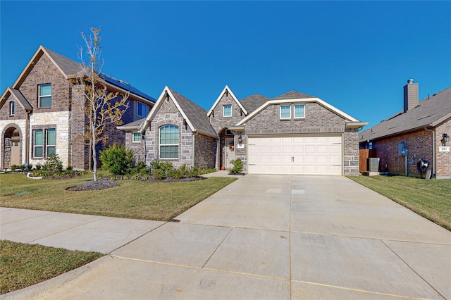 537 Val Verde St, Aubrey, TX 76227 - view of front of property with brick siding, an attached garage, driveway, and a front yard