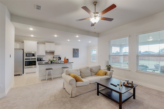537 Val Verde St, Aubrey, TX 76227 - living area featuring light colored carpet, recessed lighting, a ceiling fan, baseboards, and visible vents