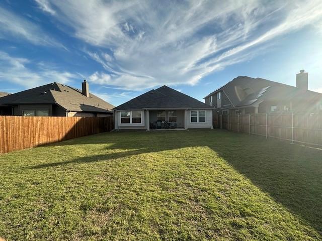 537 Val Verde St, Aubrey, TX 76227 - rear view of property with a fenced backyard and a lawn