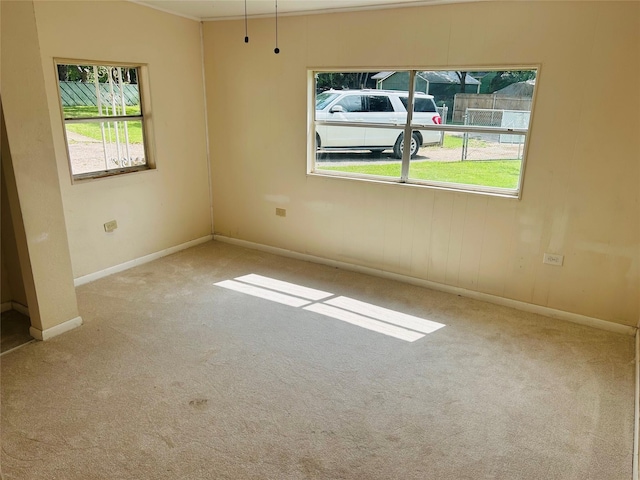 empty room with carpet floors and baseboards