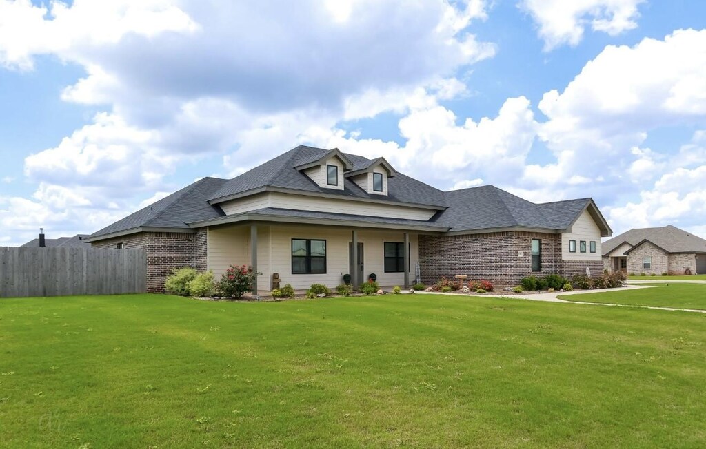149 Oak Hill Rd, Tuscola, TX 79562 - view of front of home featuring brick siding and roof with shingles