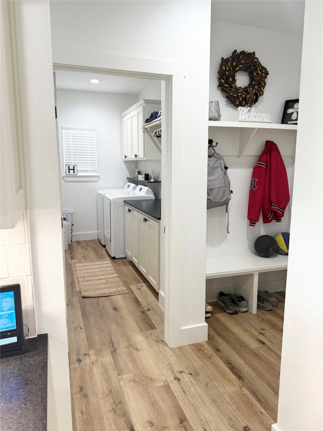 mudroom with independent washer and dryer, recessed lighting, baseboards, and light wood finished floors