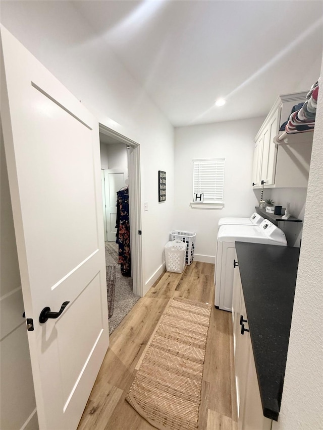 laundry room featuring light wood-type flooring, cabinet space, baseboards, recessed lighting, and washer and clothes dryer