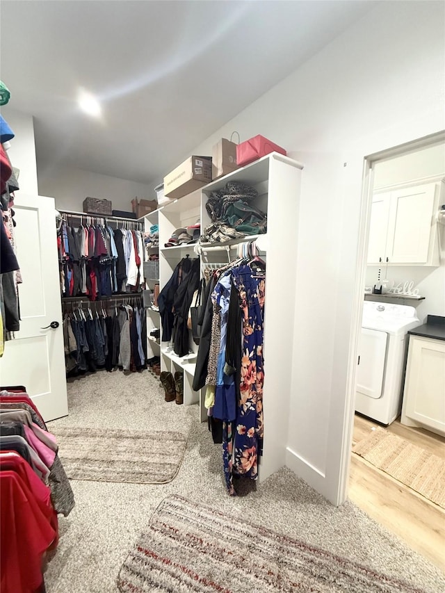 spacious closet featuring washer / dryer