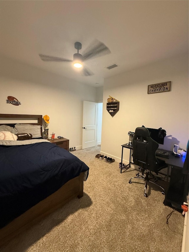 bedroom with carpet floors, baseboards, ceiling fan, and a desk