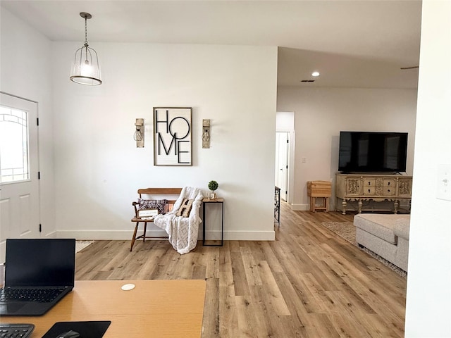 foyer with baseboards, recessed lighting, and light wood finished floors